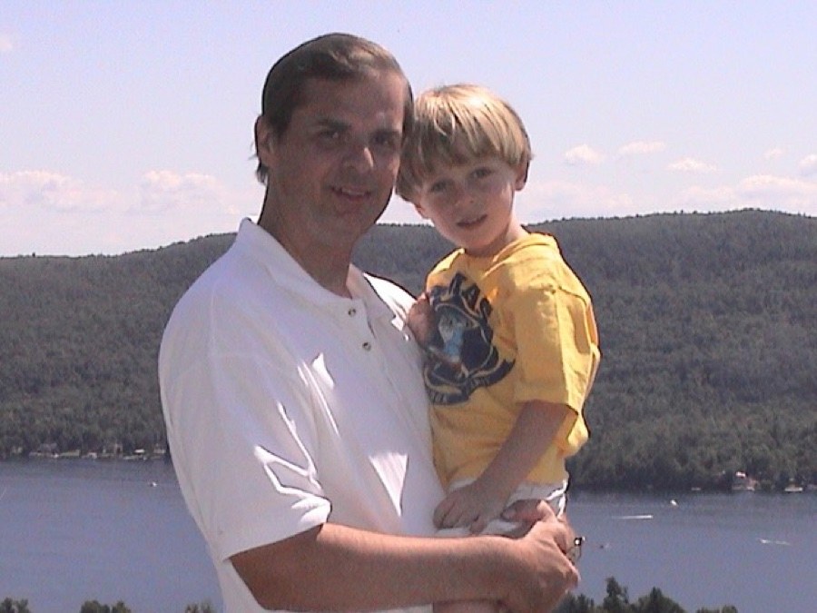 William Miecuna holding his young son Billy by Lake George
